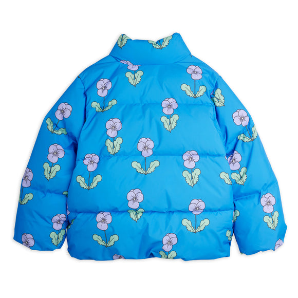 A bright blue puffer jacket with an allover floral pattern of light purple flowers and green leaves, shown flat against a white background.