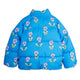 A bright blue puffer jacket with an allover floral pattern of light purple flowers and green leaves, shown flat against a white background.