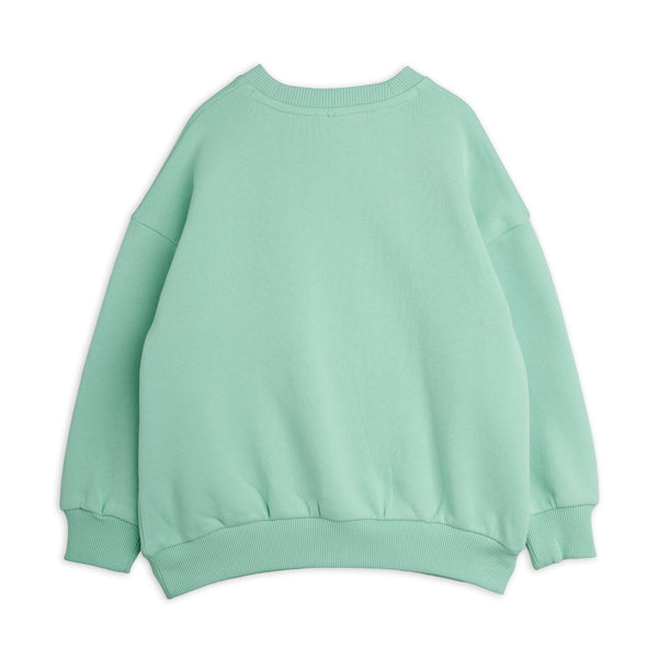 A mint green crewneck sweatshirt shown from the back, laid flat against a solid white background.