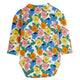 A long-sleeve baby bodysuit featuring a colorful floral print of pansies in pink, blue, yellow, and orange on an off-white background, shown flat against a white studio backdrop.
