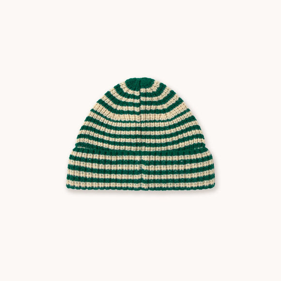 A striped knit beanie hat with alternating dark green and cream horizontal stripes, centered on a solid off-white background.