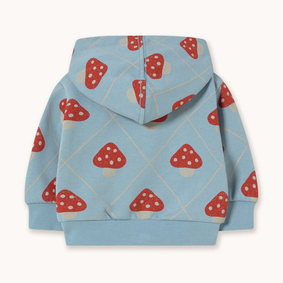 A light blue hooded sweatshirt with an allover red and white mushroom print, shown flat against a solid off-white background.