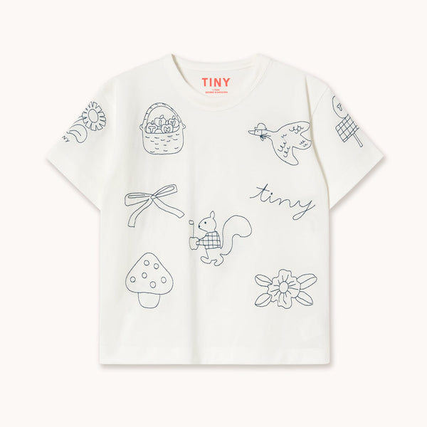 A white short-sleeve T-shirt with delicate black line-art illustrations of a basket, dragonfly, bird, mushroom, squirrel, flower, and the word 'tiny' across the front. The brand name 'TINY' is printed in red on the inside neck label.