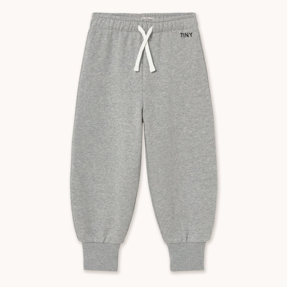 Light heather gray jogger pants with a white drawstring and a small black 'TONY' logo on the upper right hip, displayed flat against a light off-white background.