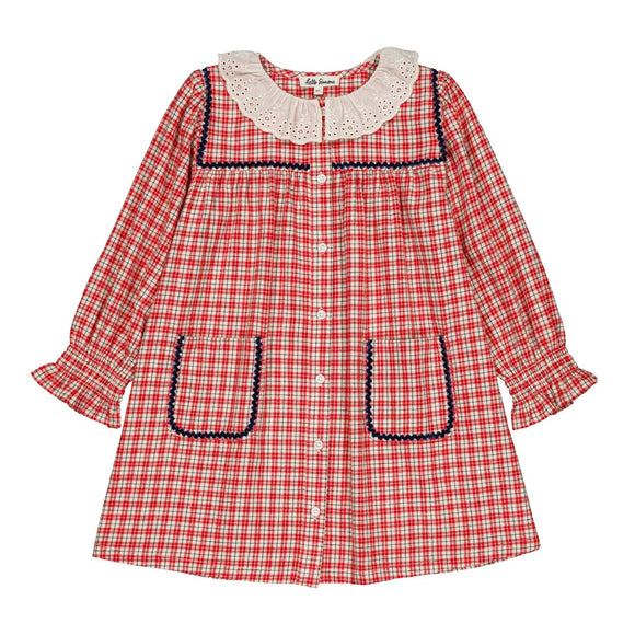 A red and white gingham long-sleeve dress for toddlers, featuring a cream-colored lace Peter Pan collar with dark blue trim, decorative dark blue trim around the front pockets, and a button-up front.