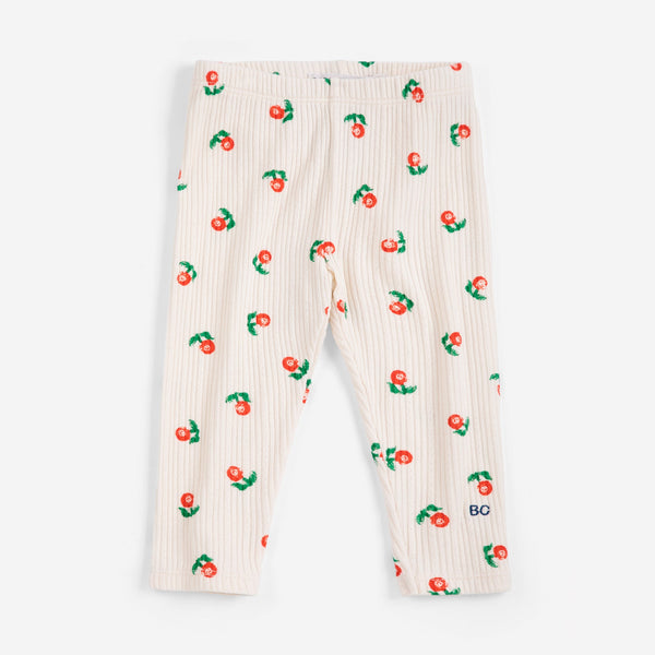White ribbed baby leggings with cherry pattern on a white background