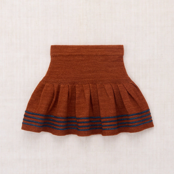 Brown skirt with blue stripes on a white background