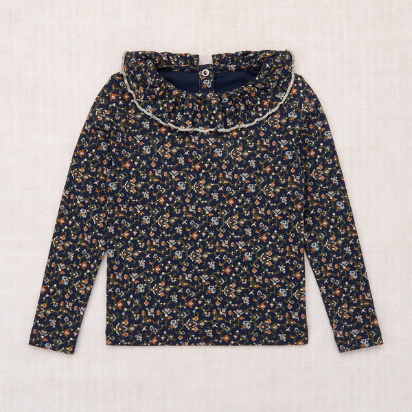 Floral-patterned blouse on a white background