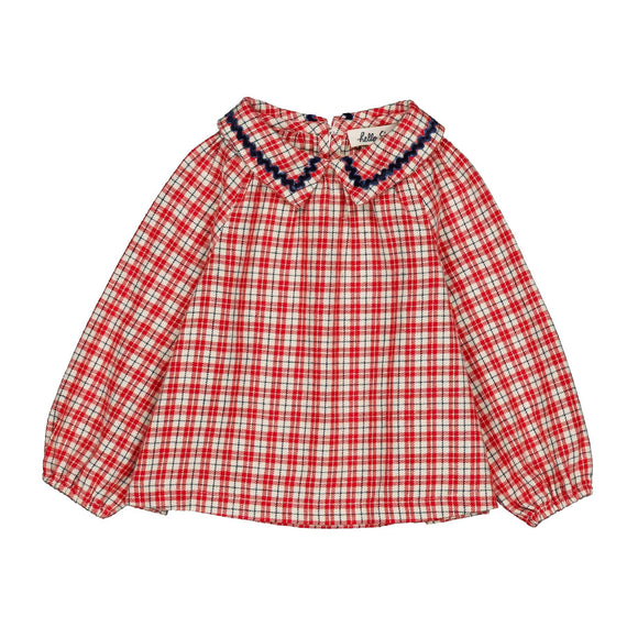 A red and white checkered long-sleeve blouse with a dark navy blue ruffled collar, displayed flat against a plain white background.