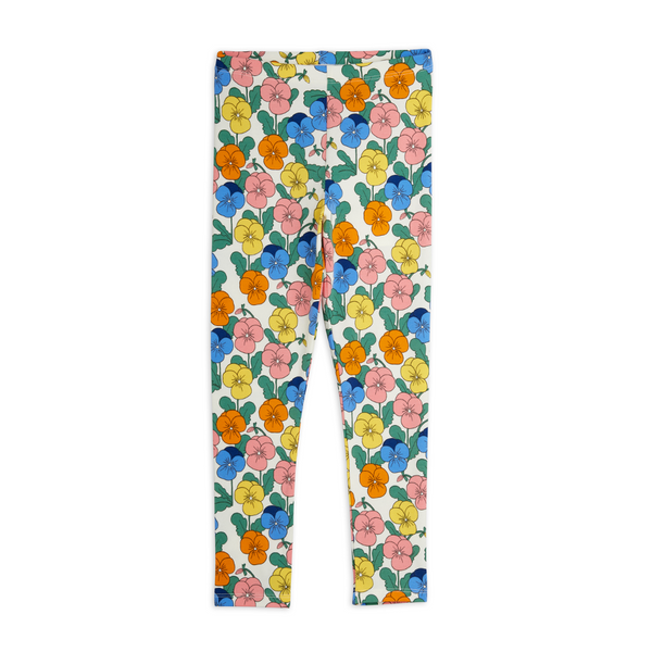 A pair of children's leggings with a colorful floral print on a white background, featuring pink, yellow, orange, and blue flowers with green leaves.