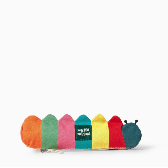 A colorful caterpillar-themed zipper pouch by Anna Nelson, featuring vertical stripes of orange, green, pink, teal, yellow, red, and dark teal, with the brand name embroidered on the center segment.