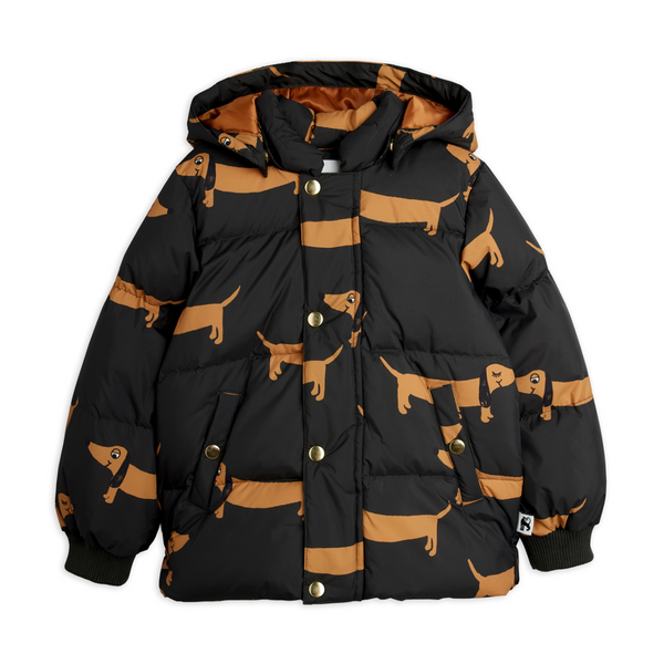 A black hooded puffer jacket with an allover tan dachshund print, featuring gold-tone snap buttons and ribbed cuffs.