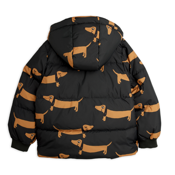 A black hooded puffer jacket shown from the back, featuring an all-over tan dachshund dog print on a plain white background.