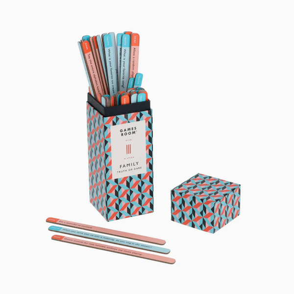 A Games Room with Family pencil holder set featuring a tall patterned box filled with pastel-colored pencils, a matching small box, and three loose pencils on a light gray background.
