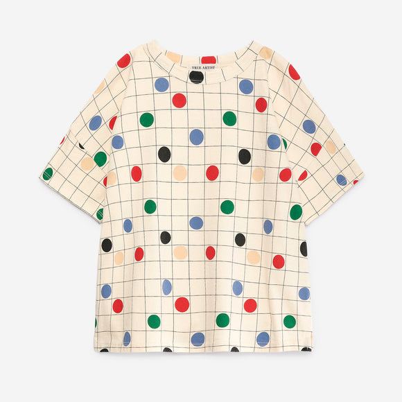 A short-sleeve crewneck top, featuring a cream-colored grid pattern overlaid with colorful polka dots in red, green, blue, black, and beige.