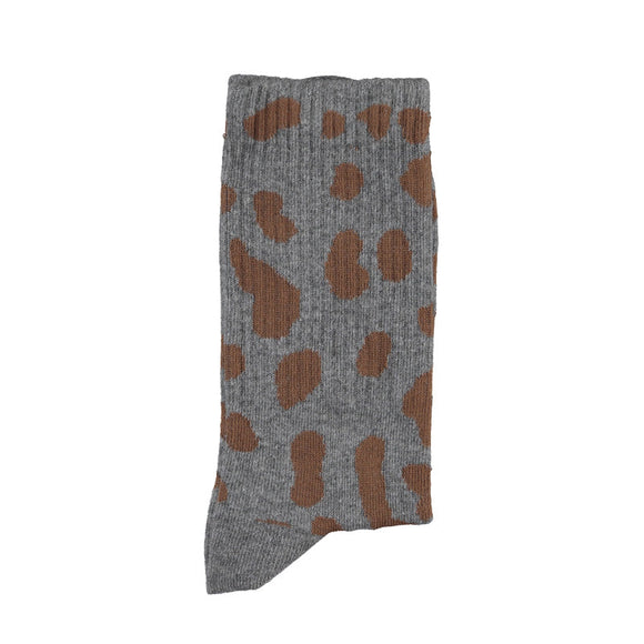 Gray sock with brown pattern on a white background