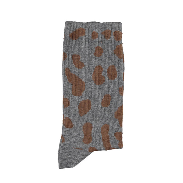 Gray sock with brown pattern on a white background